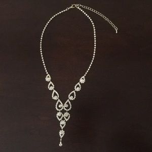 Silver sparkly necklace.